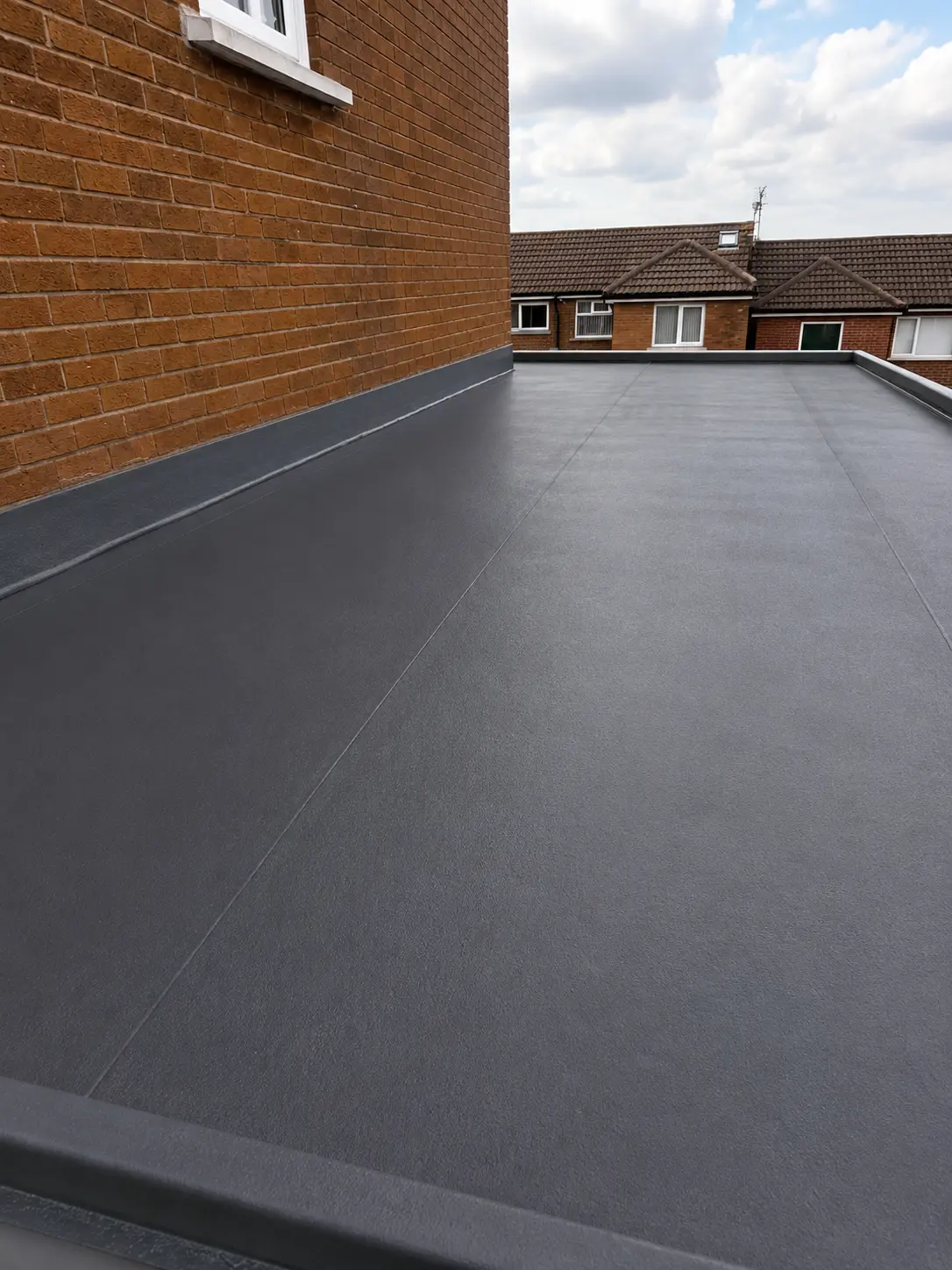 Fibreglass GRP flat roof finished in dark grey