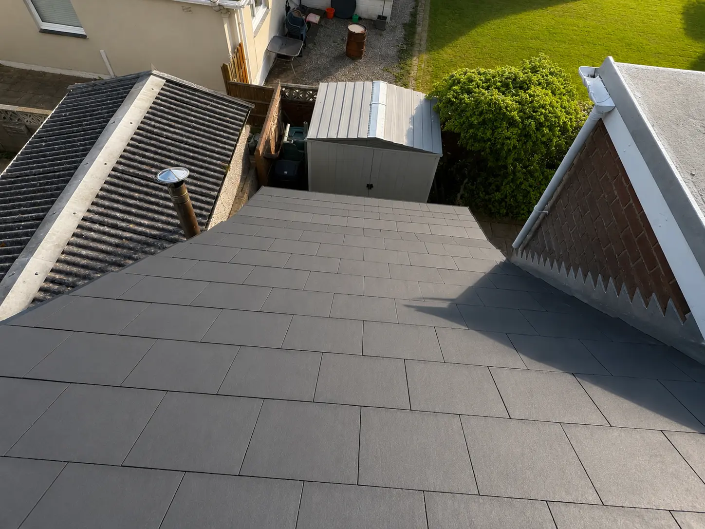 Garage and extension roof re-covered with grey tiles