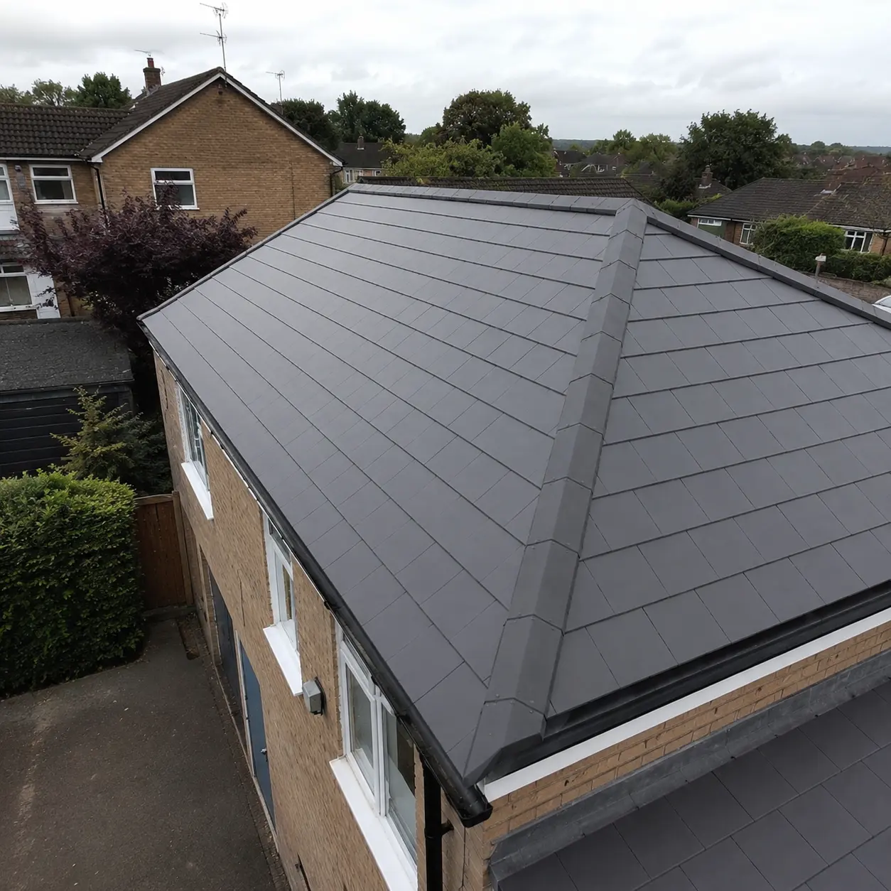 Complete house re-roof with dark grey tiles